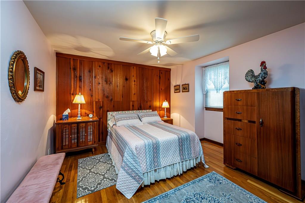 361 Middletown Road New Stanton, PA 15672 - Photo 22 of 43 a bedroom with a bed and a chandelier