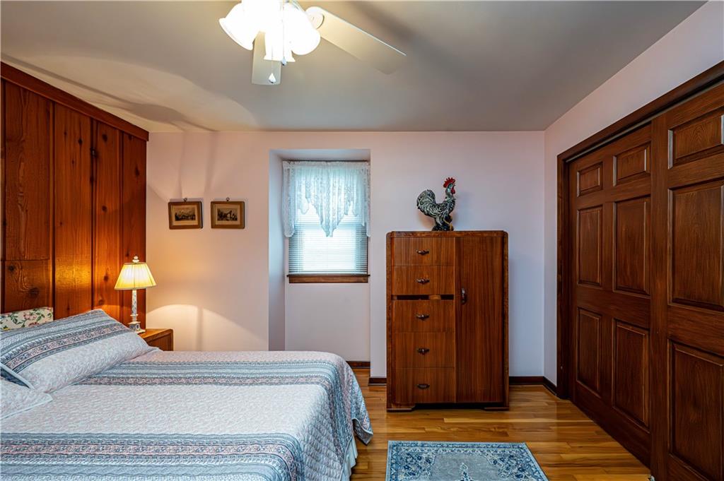 361 Middletown Road New Stanton, PA 15672 - Photo 23 of 43 a bedroom with a bed dresser and a chandelier