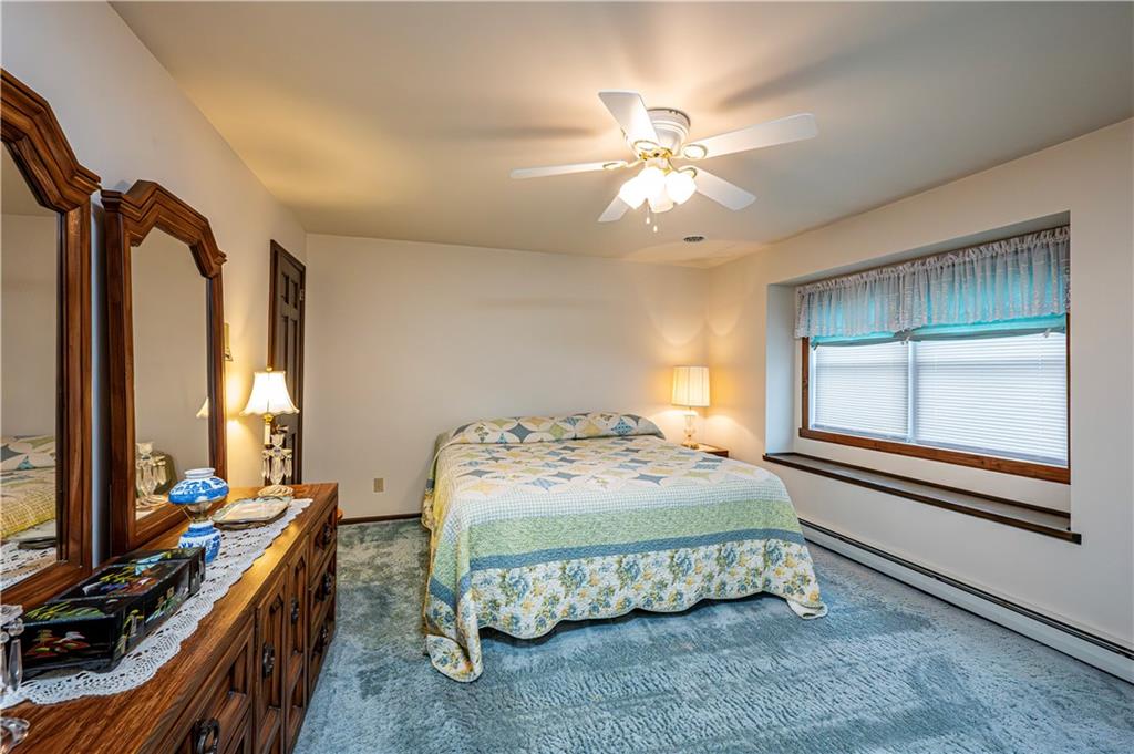 361 Middletown Road New Stanton, PA 15672 - Photo 33 of 43 a bedroom with a bed and a chandelier