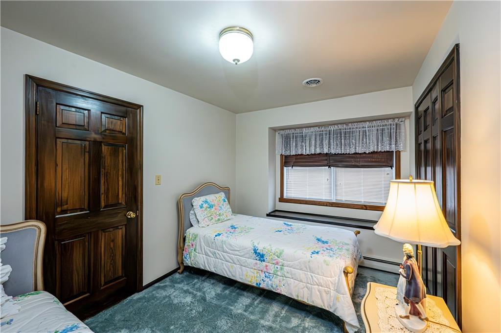361 Middletown Road New Stanton, PA 15672 - Photo 35 of 43 a bedroom with a bed and wooden floor