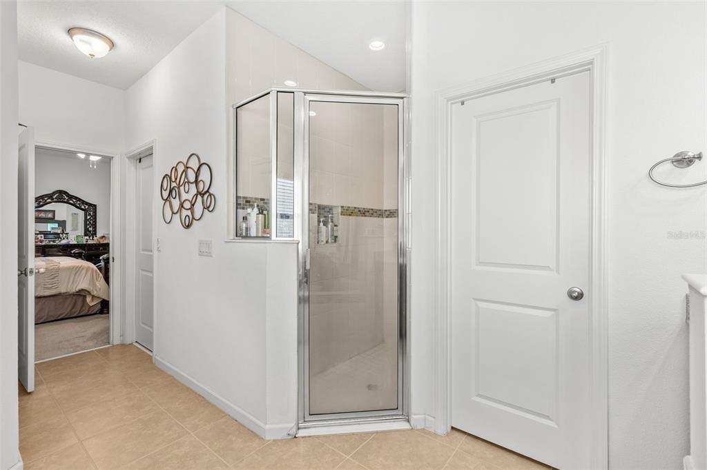 2085 Lula Road Minneola, FL 34715 - Photo 31 of 39 a walk in closet with a bathroom