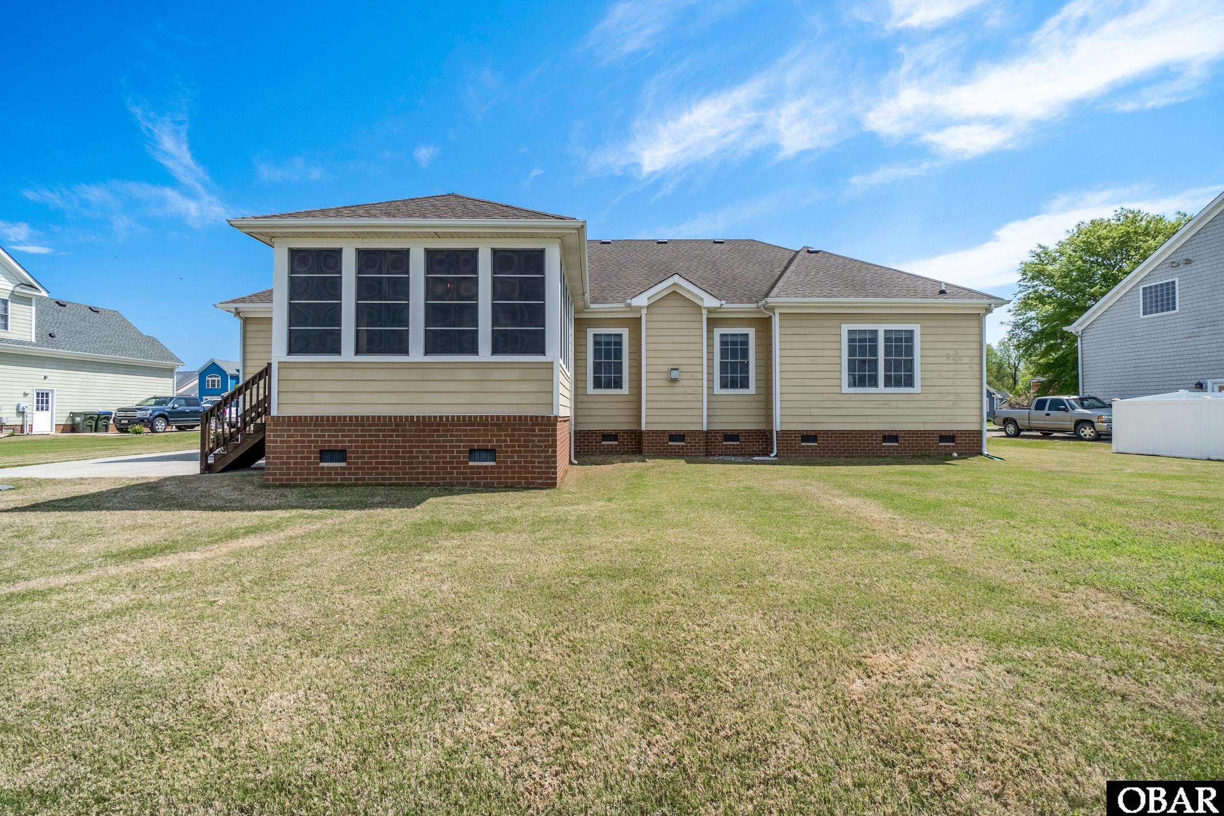 122 Bayside Drive Moyock, NC 27958 - Photo 32 of 34 Back of House with Sunroom