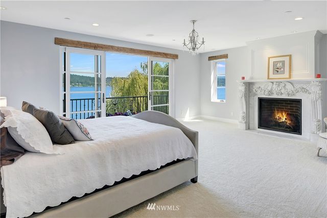 a bedroom with bed and a fireplace