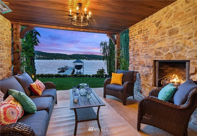 a outdoor living space with patio furniture and a fireplace