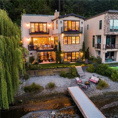 a front view of a house with lake view and a garden
