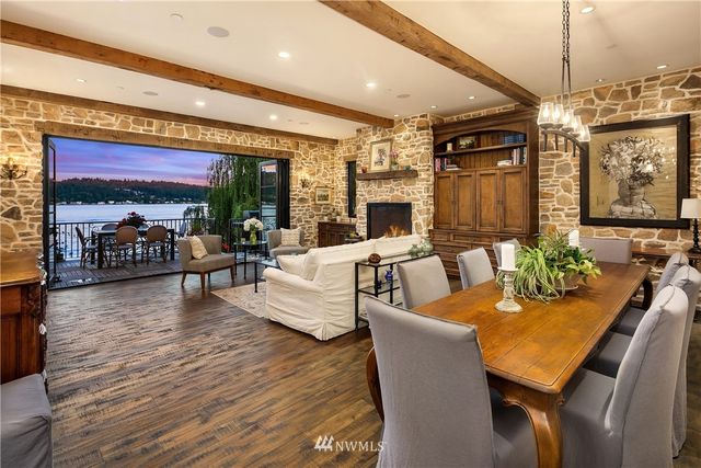 a living room with fireplace furniture and a flat screen tv