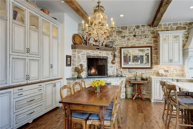 a living room with kitchen island furniture and a fireplace