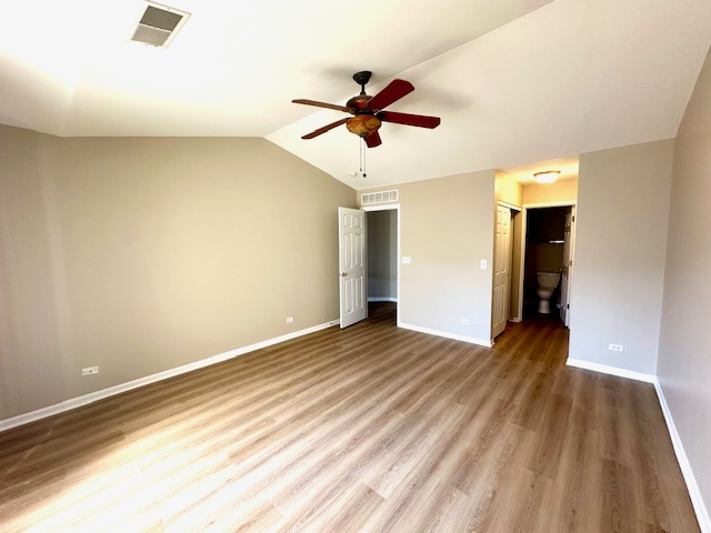 122 Enclave Circle, Unit D Bolingbrook, IL 60440 - Photo 13 of 20 a view of a room with wooden floor and ceiling fan