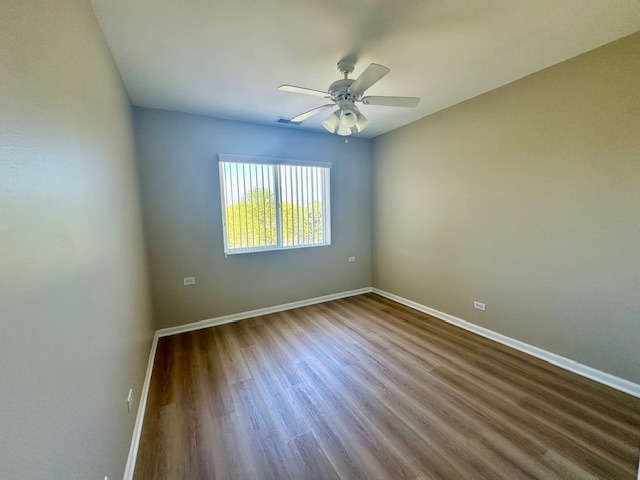 122 Enclave Circle, Unit D Bolingbrook, IL 60440 - Photo 16 of 20 a view of an empty room and wooden floor