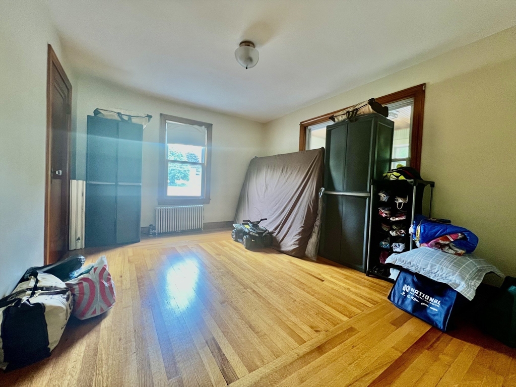 29 Brookfield Road, Unit 1 Sturbridge, MA 01518 - Photo 8 of 9 a bedroom with a bed dresser and a window