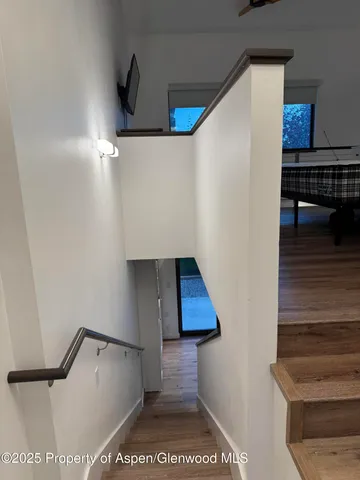 a bathroom with a toilet sink vanity and mirror