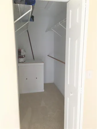 a view of walk in closet with window