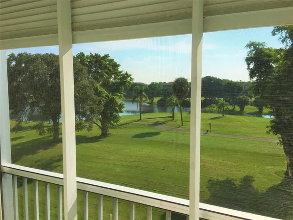 a view of a room with a big yard