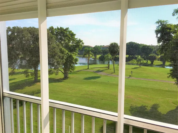 a view of a glass door with a yard