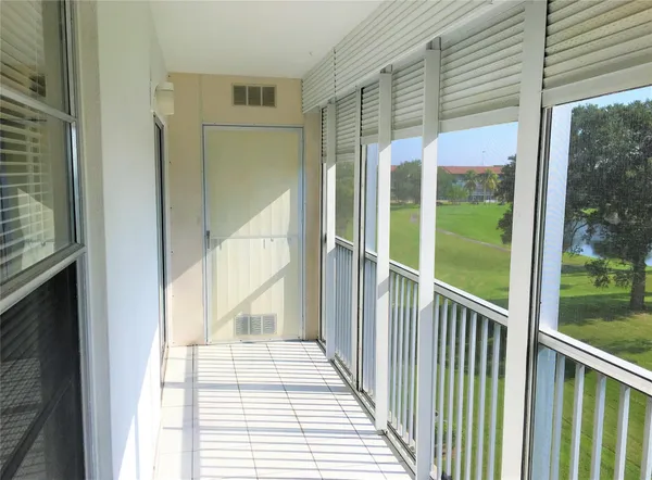 a view of a porch with a big yard