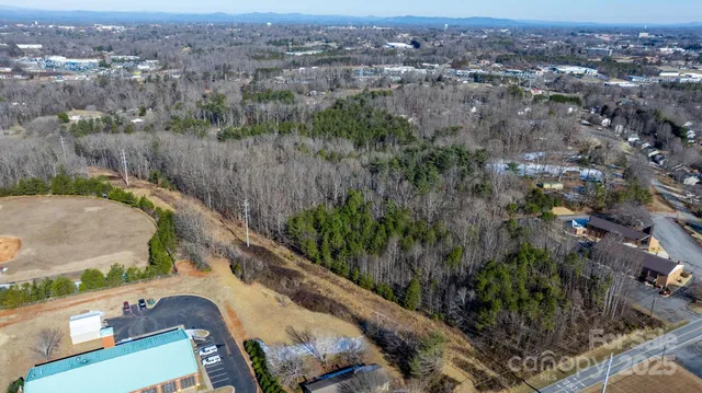 an aerial view of a house with a swimming pool