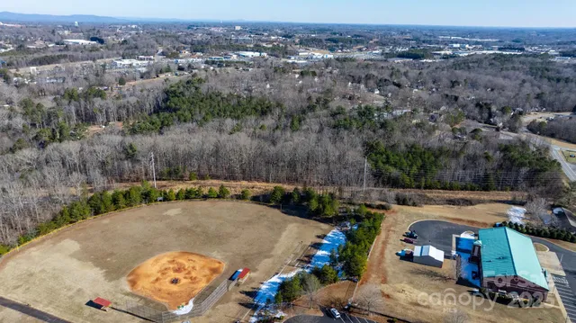 an aerial view of residential house and green space