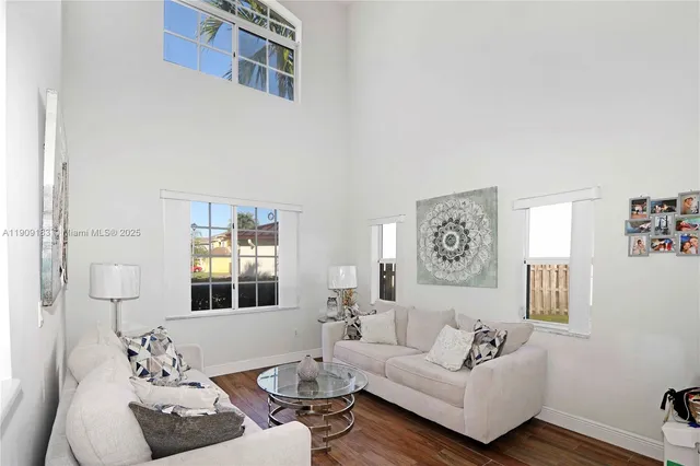 a living room with furniture and window