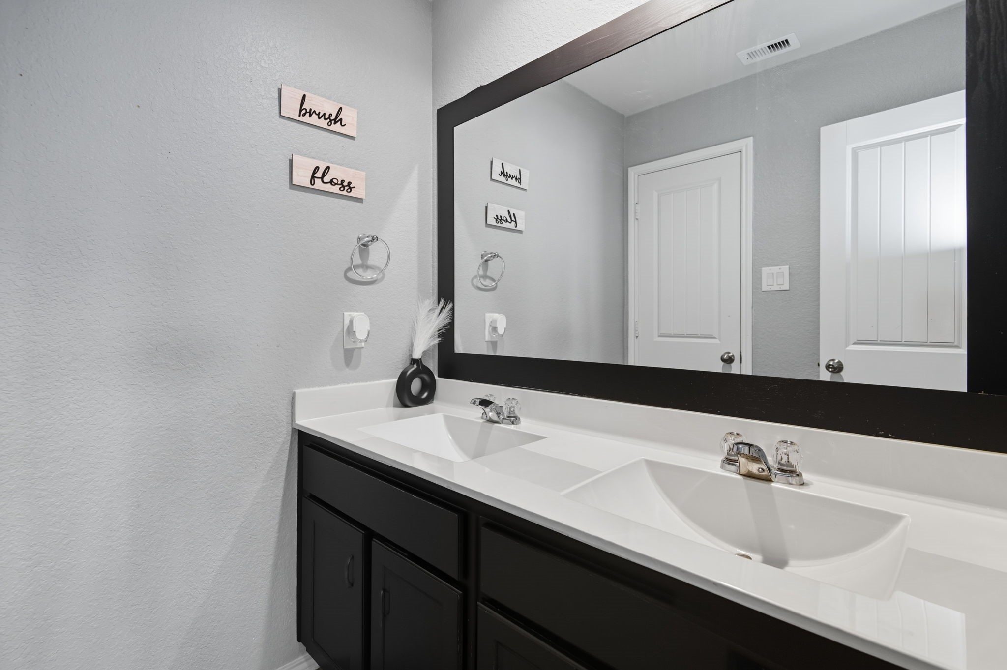 935 Bright Lotus Lane Rosharon, TX 77583 - Photo 12 of 18 a bathroom with a sink and a mirror