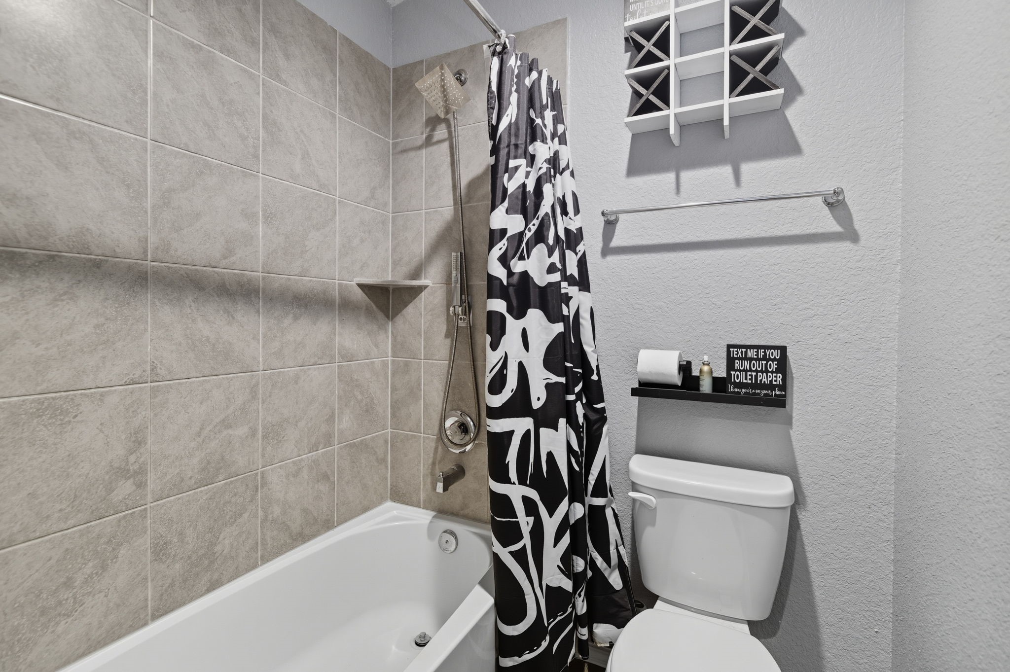 935 Bright Lotus Lane Rosharon, TX 77583 - Photo 13 of 18 a white toilet sitting next to a bath tub