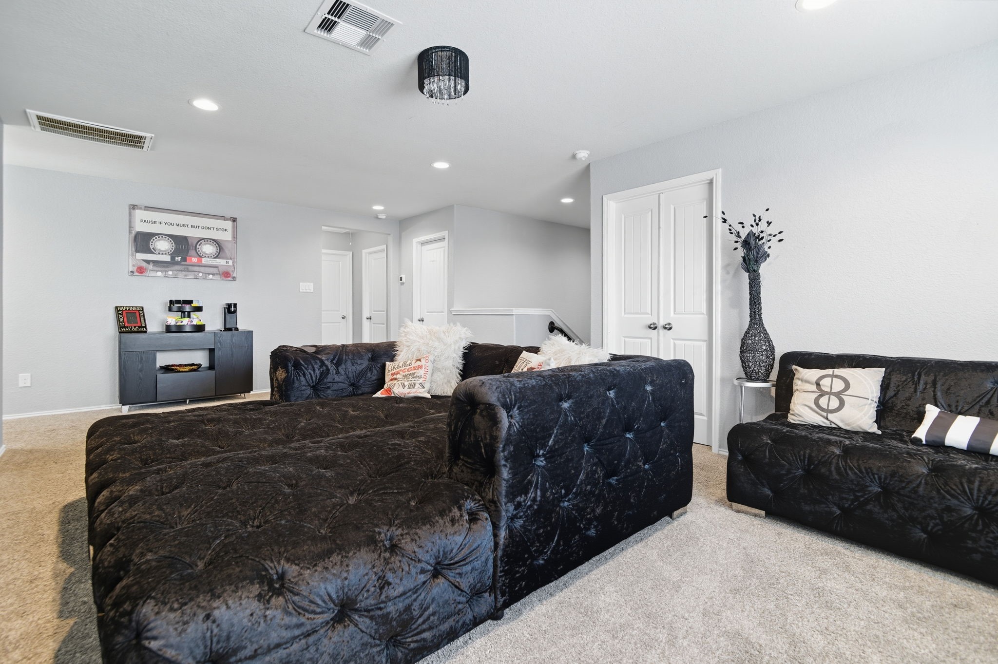 935 Bright Lotus Lane Rosharon, TX 77583 - Photo 10 of 18 a large bedroom with a bed a couch and a view of kitchen