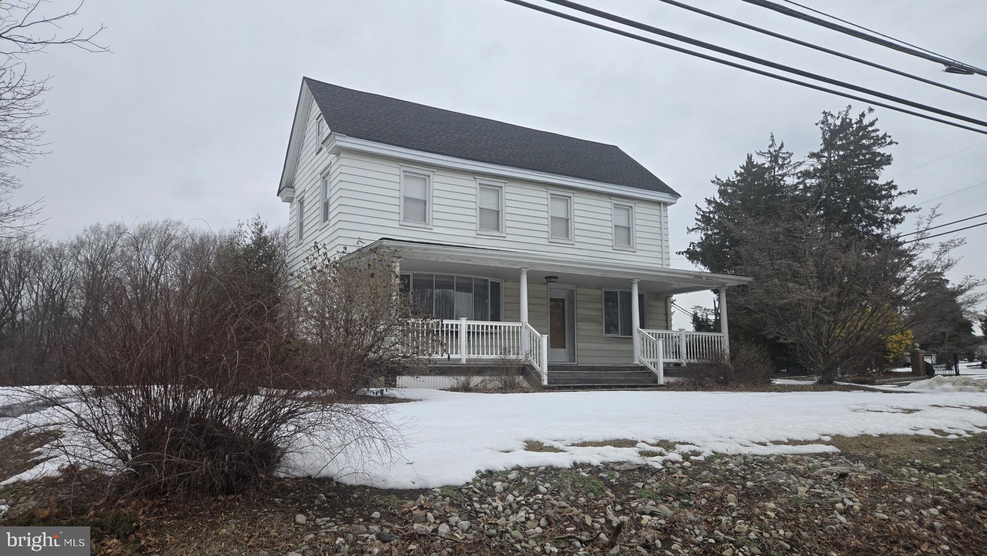 10 Garwin Road Swedesboro, NJ 08085 - Photo 1 of 13 a front view of a house with a yard covered in snow