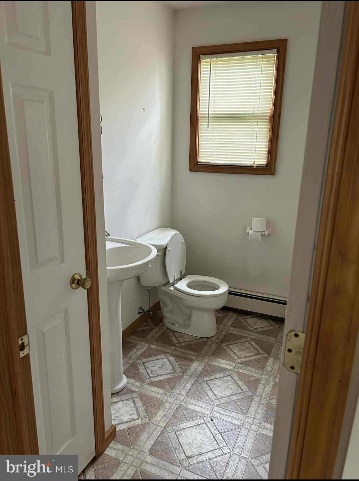 10 Garwin Road Swedesboro, NJ 08085 - Photo 7 of 13 a bathroom with a toilet and a mirror