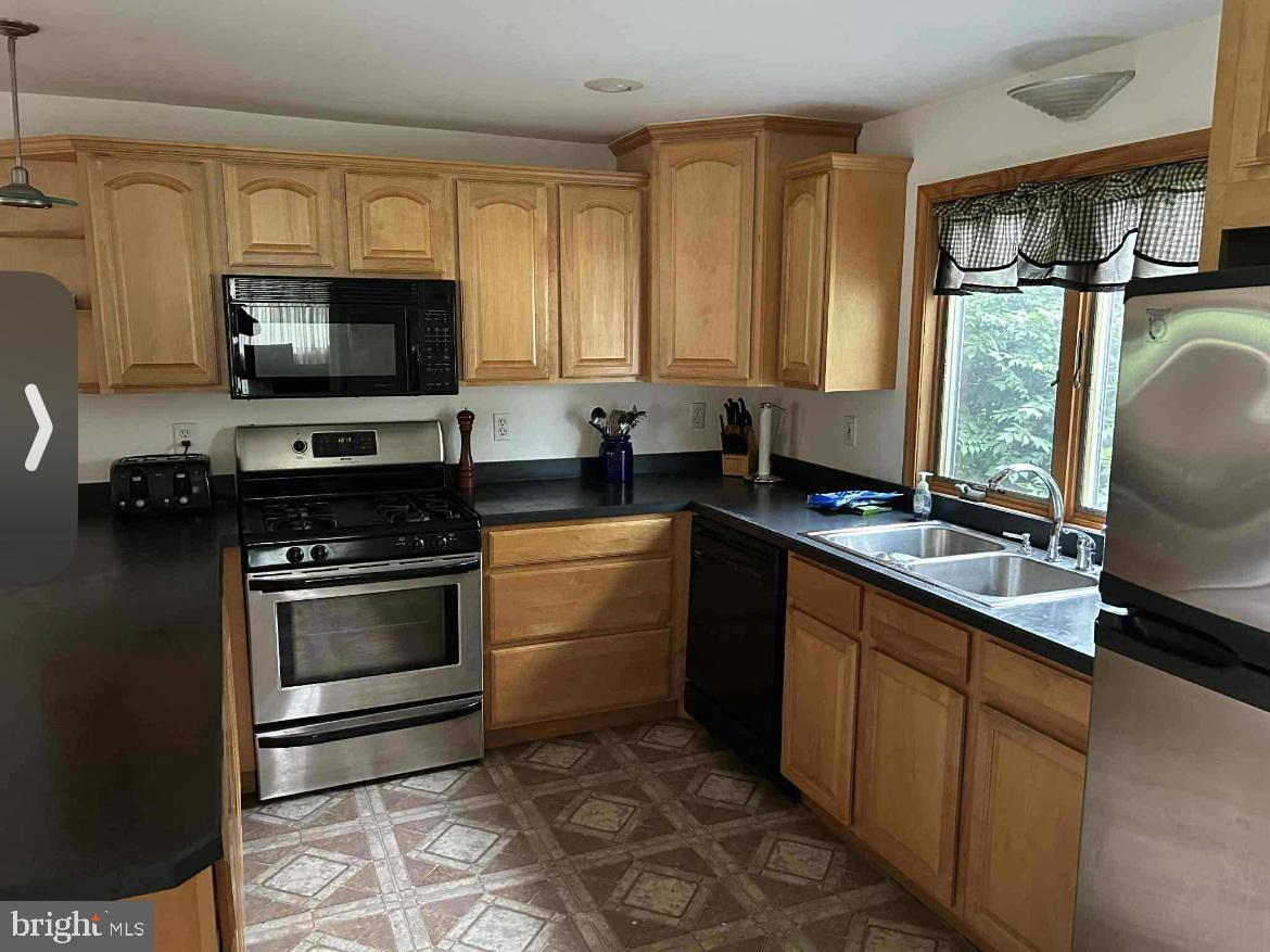 10 Garwin Road Swedesboro, NJ 08085 - Photo 10 of 13 a kitchen with a sink stove and microwave
