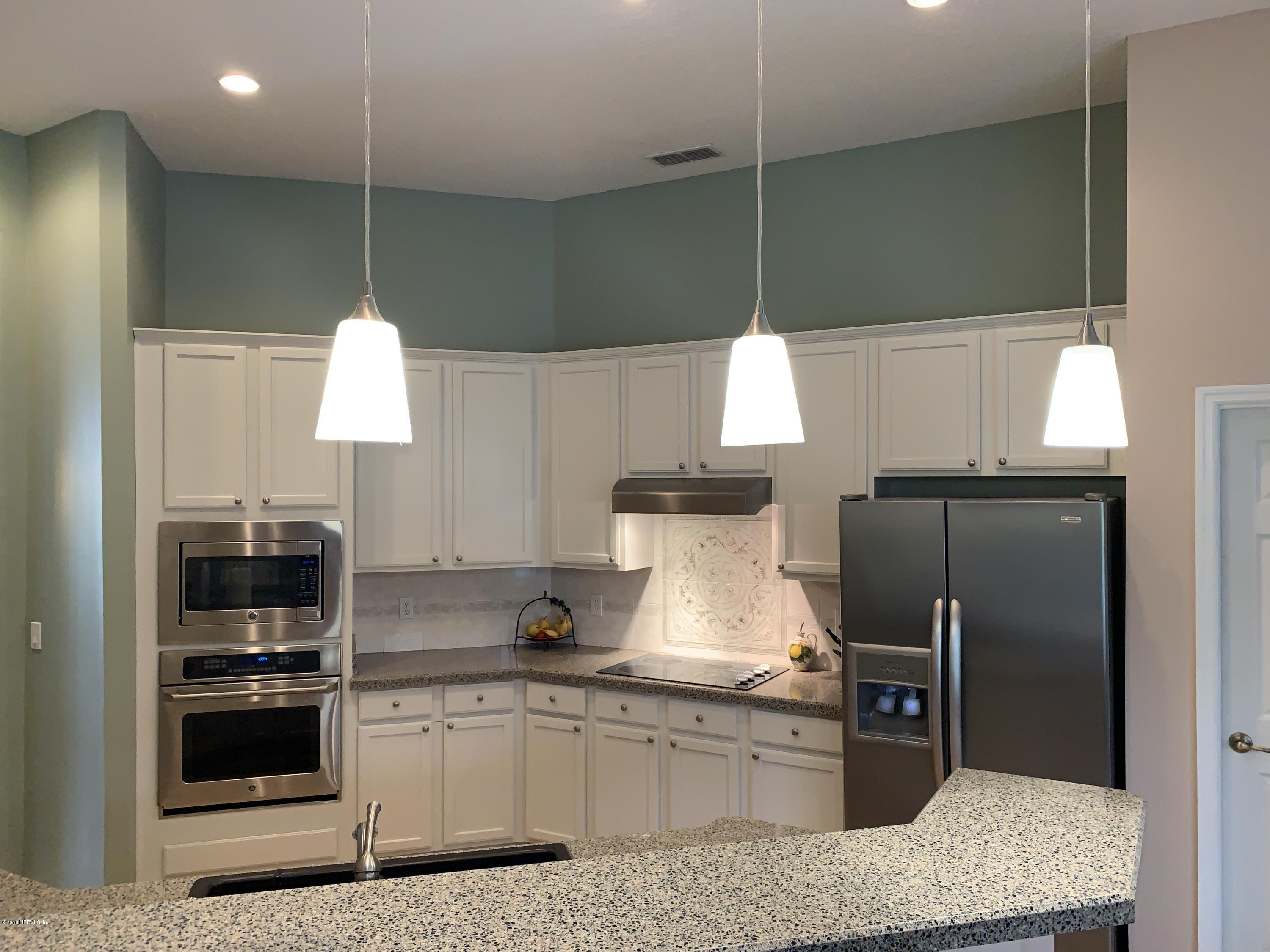 1925 Lyndhurst Drive St. Augustine, FL 32092 - Photo 11 of 52 a kitchen with stainless steel appliances granite countertop a sink a stove and a refrigerator
