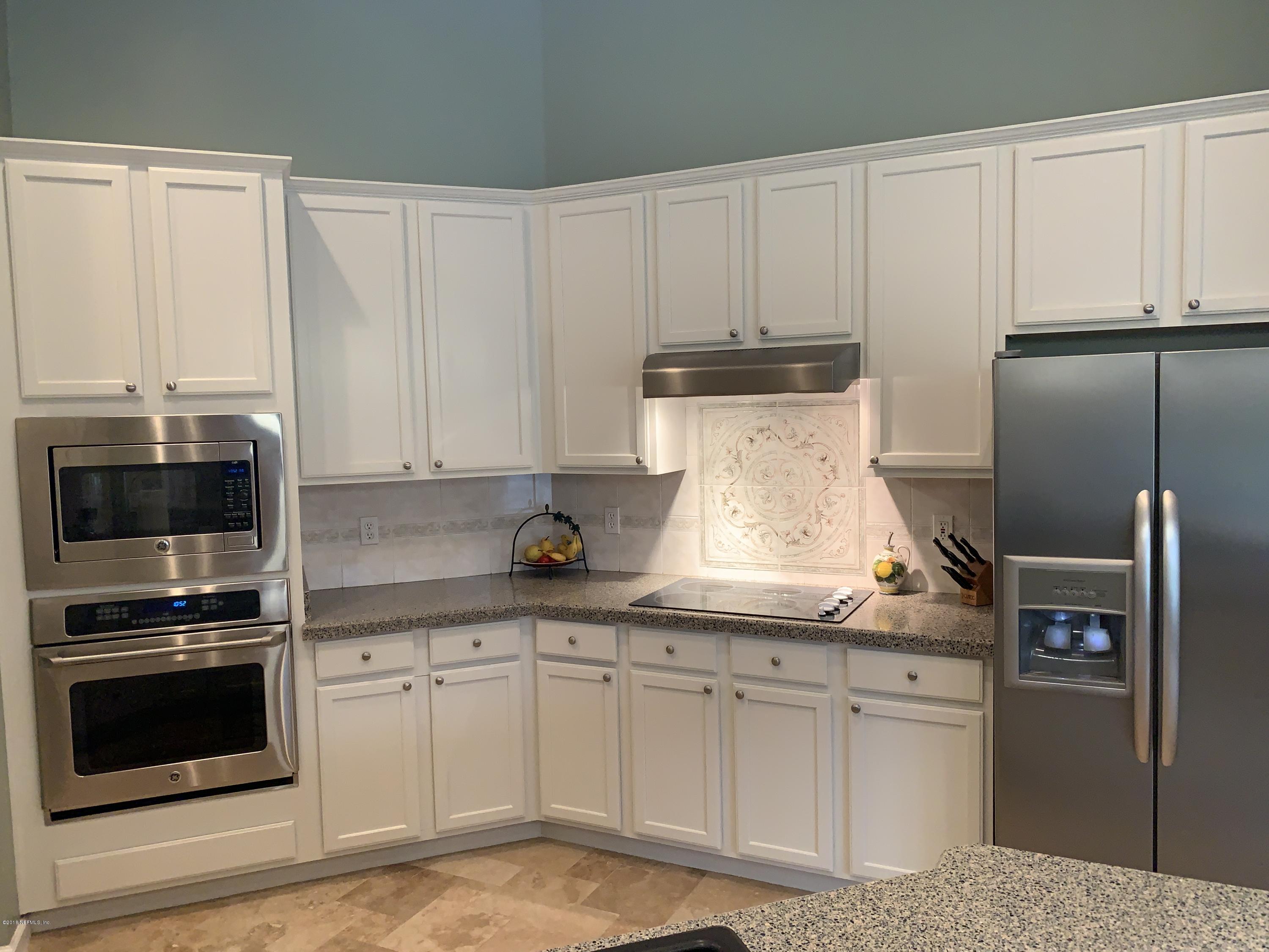 1925 Lyndhurst Drive St. Augustine, FL 32092 - Photo 12 of 52 a kitchen with granite countertop white cabinets and stainless steel appliances