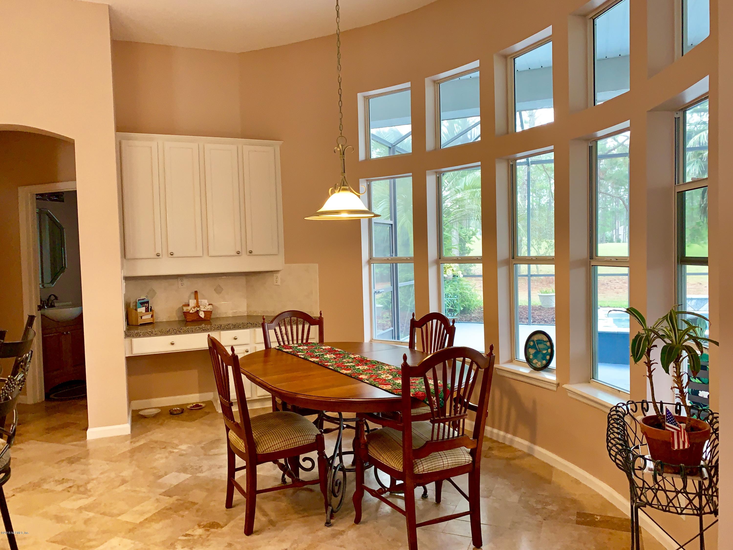 1925 Lyndhurst Drive St. Augustine, FL 32092 - Photo 15 of 52 a view of a dining room with furniture window and outside view