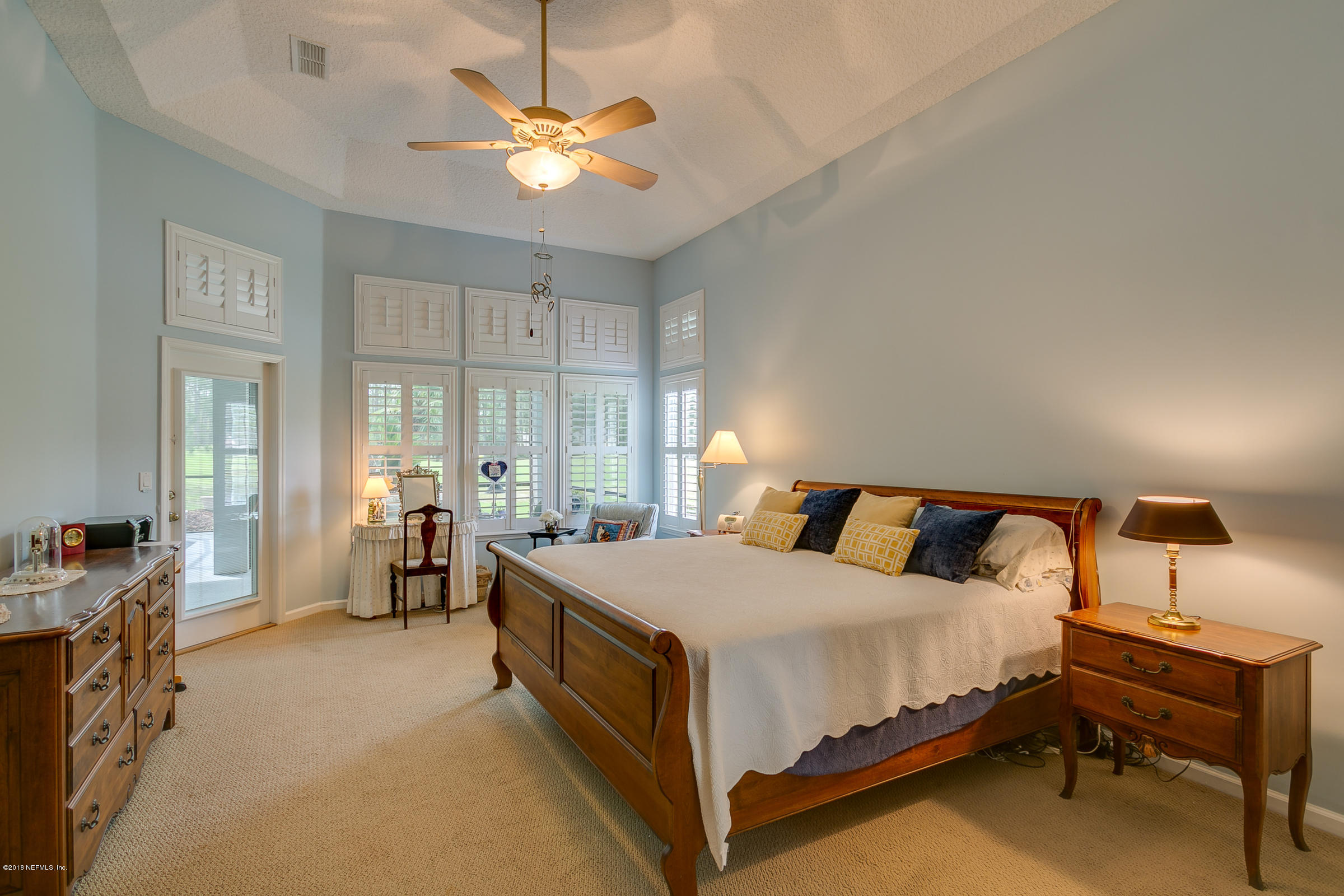 1925 Lyndhurst Drive St. Augustine, FL 32092 - Photo 17 of 52 a bed room with a bed and a chandelier