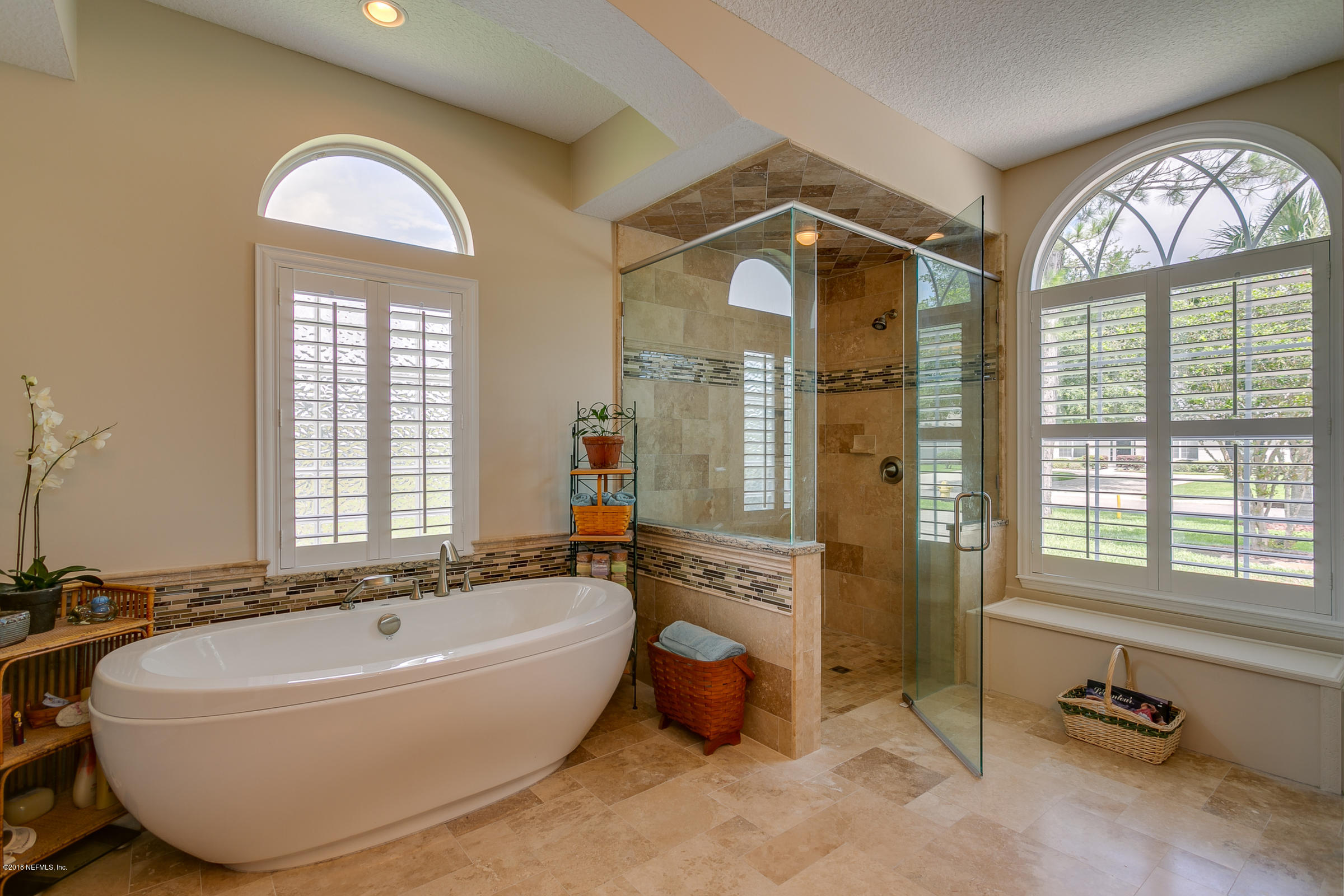 1925 Lyndhurst Drive St. Augustine, FL 32092 - Photo 19 of 52 a spacious bathroom with a tub and a large window