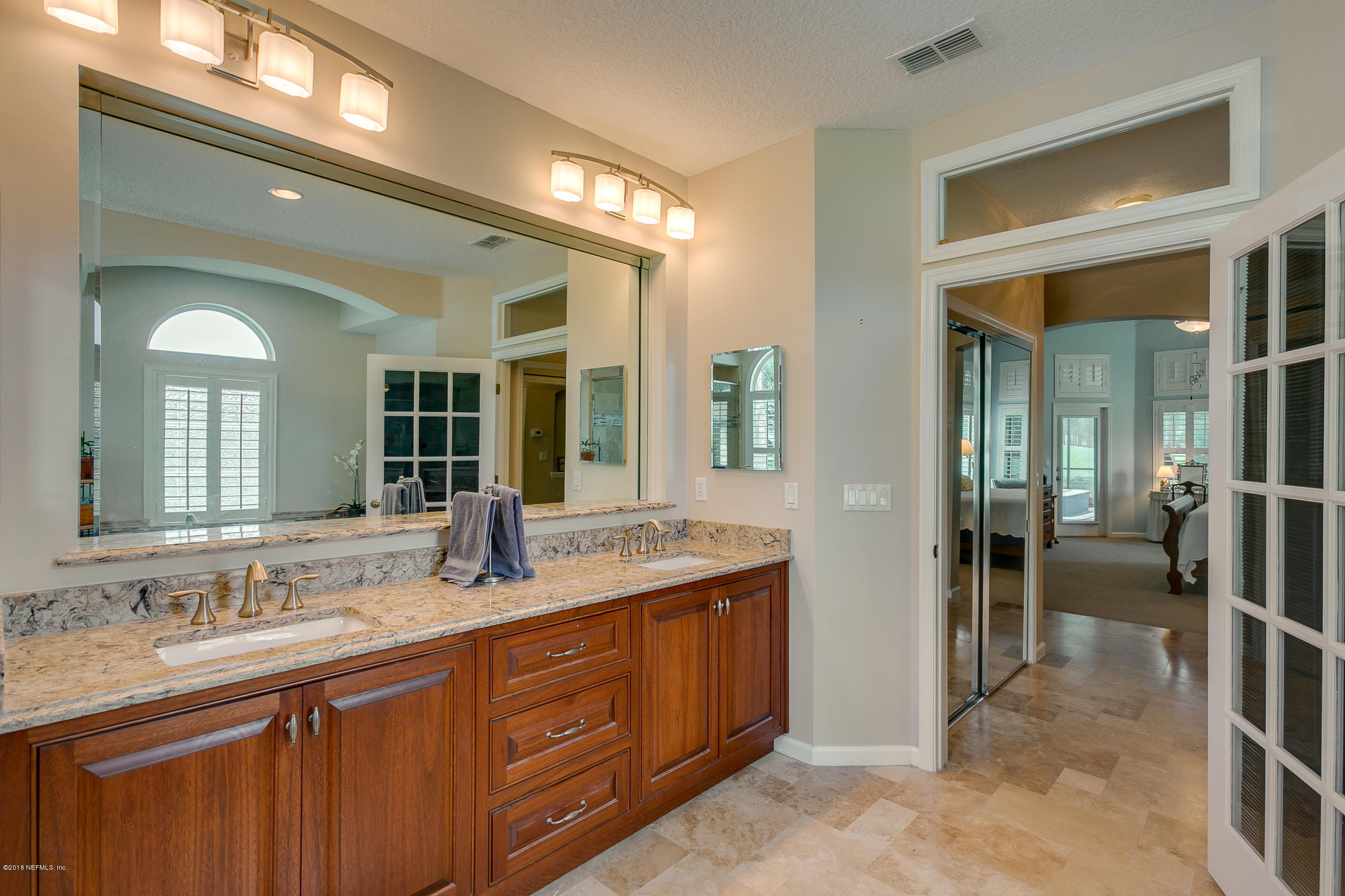 1925 Lyndhurst Drive St. Augustine, FL 32092 - Photo 20 of 52 a spacious bathroom with double vanity and a mirror