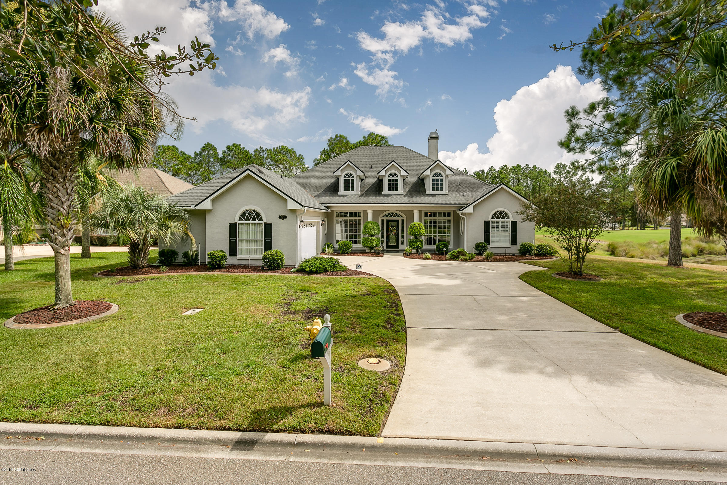 1925 Lyndhurst Drive St. Augustine, FL 32092 - Photo 2 of 52 a front view of a house with garden