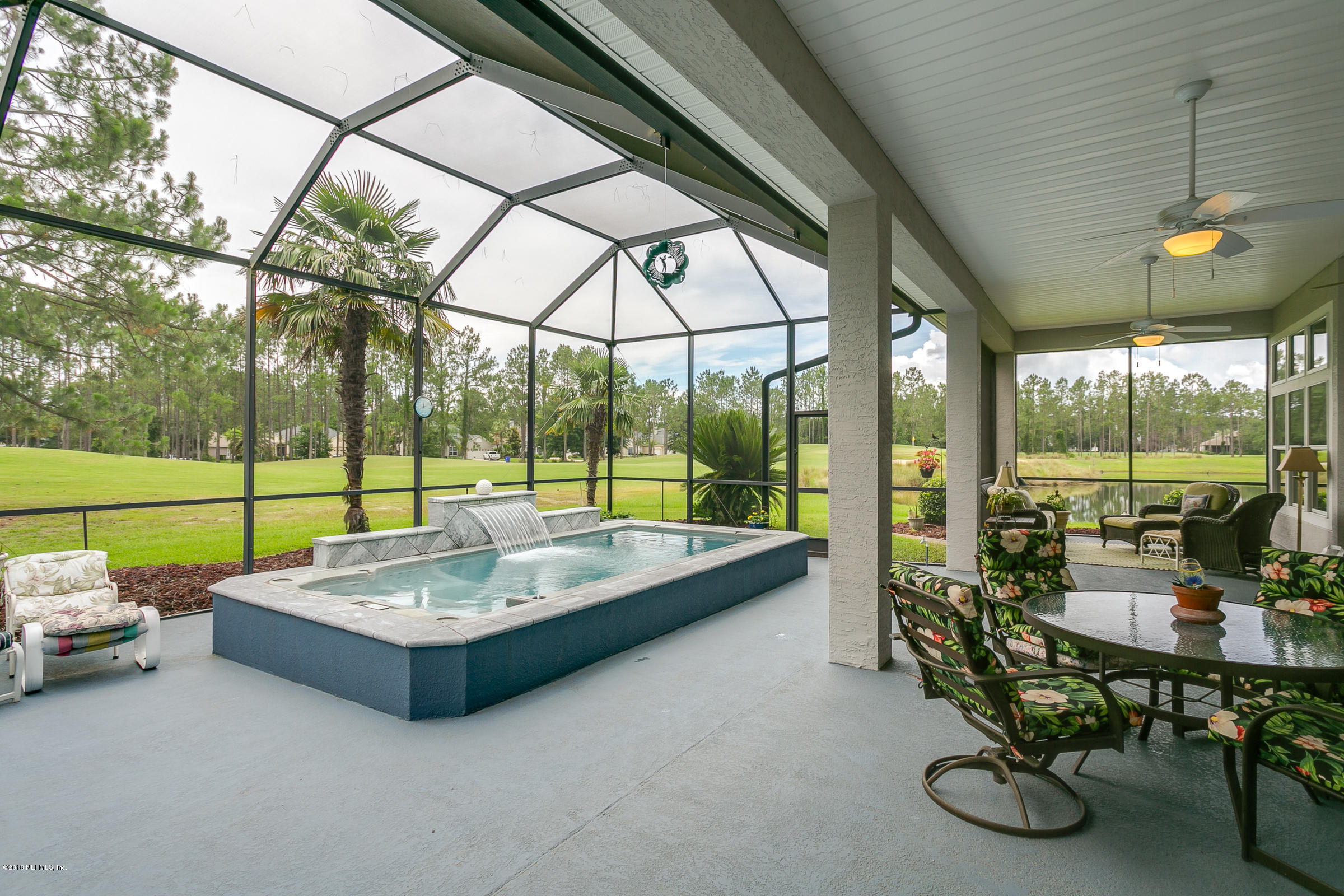 1925 Lyndhurst Drive St. Augustine, FL 32092 - Photo 28 of 52 a living room with furniture and a floor to ceiling window