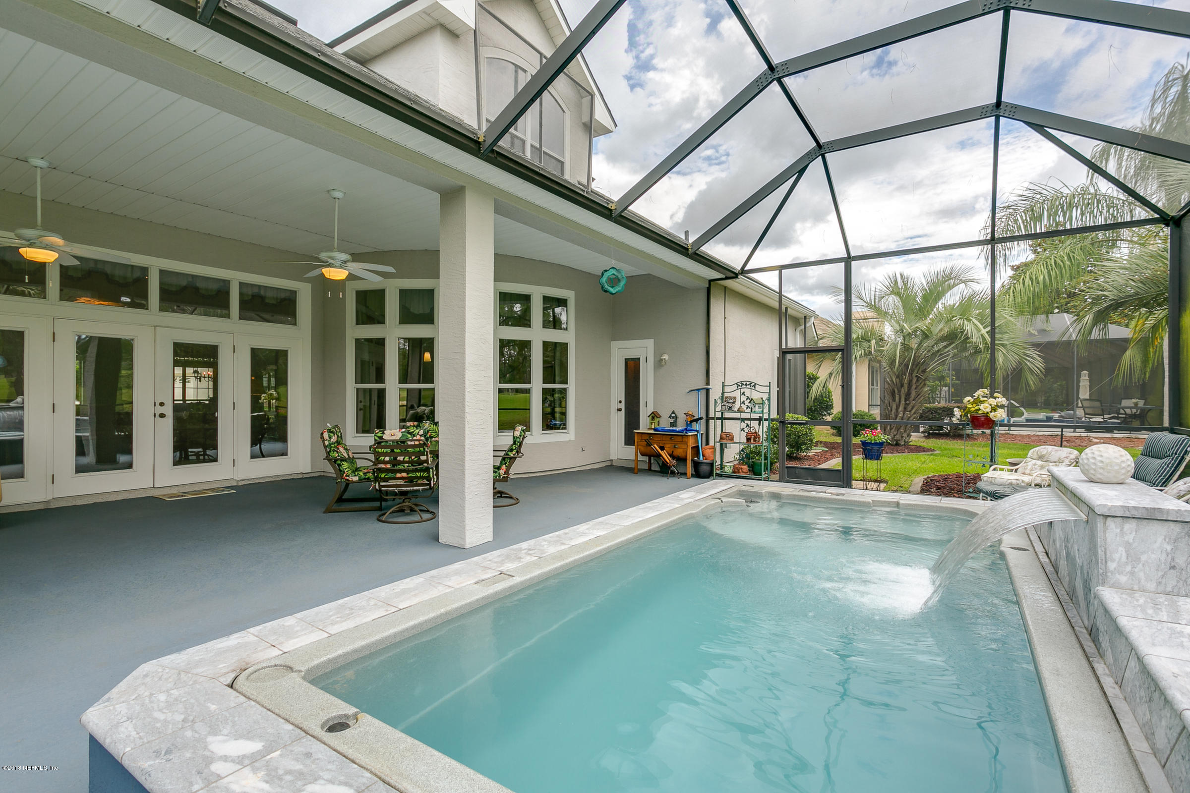 1925 Lyndhurst Drive St. Augustine, FL 32092 - Photo 30 of 52 a view of a patio with swimming pool table and chairs