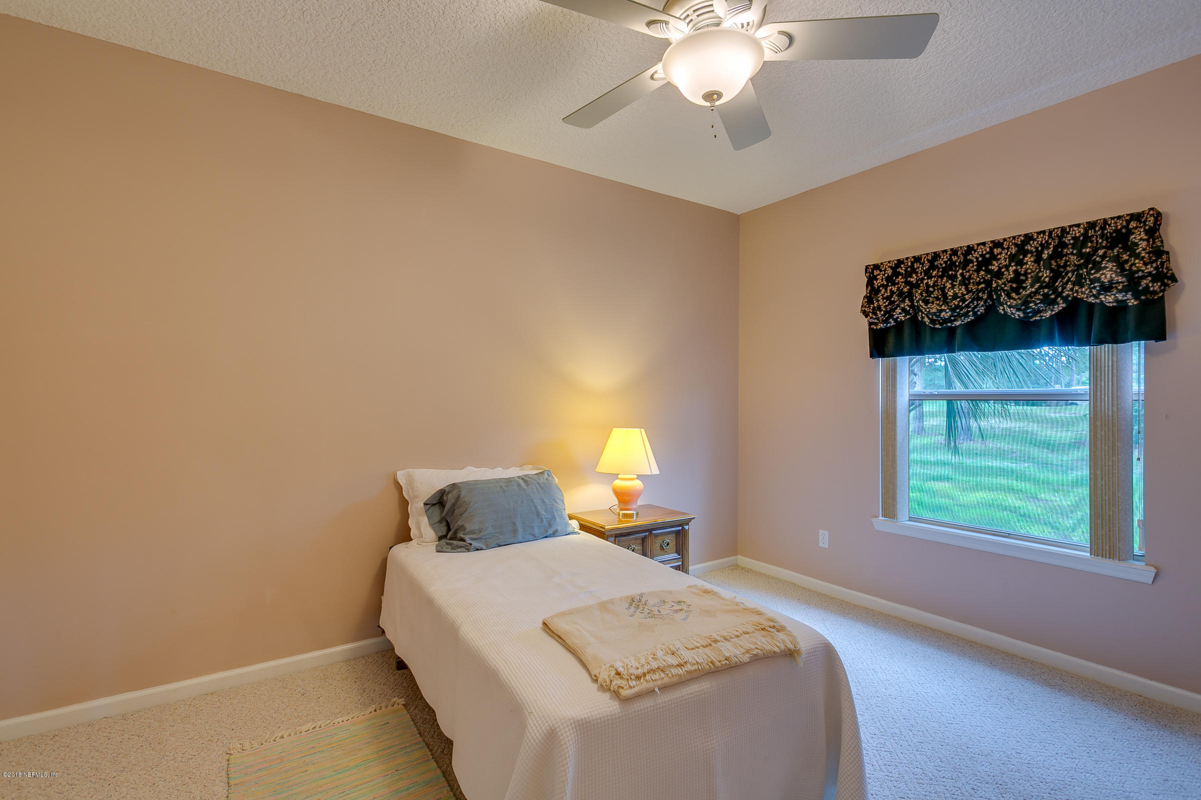 1925 Lyndhurst Drive St. Augustine, FL 32092 - Photo 34 of 52 a bedroom with a bed and a window