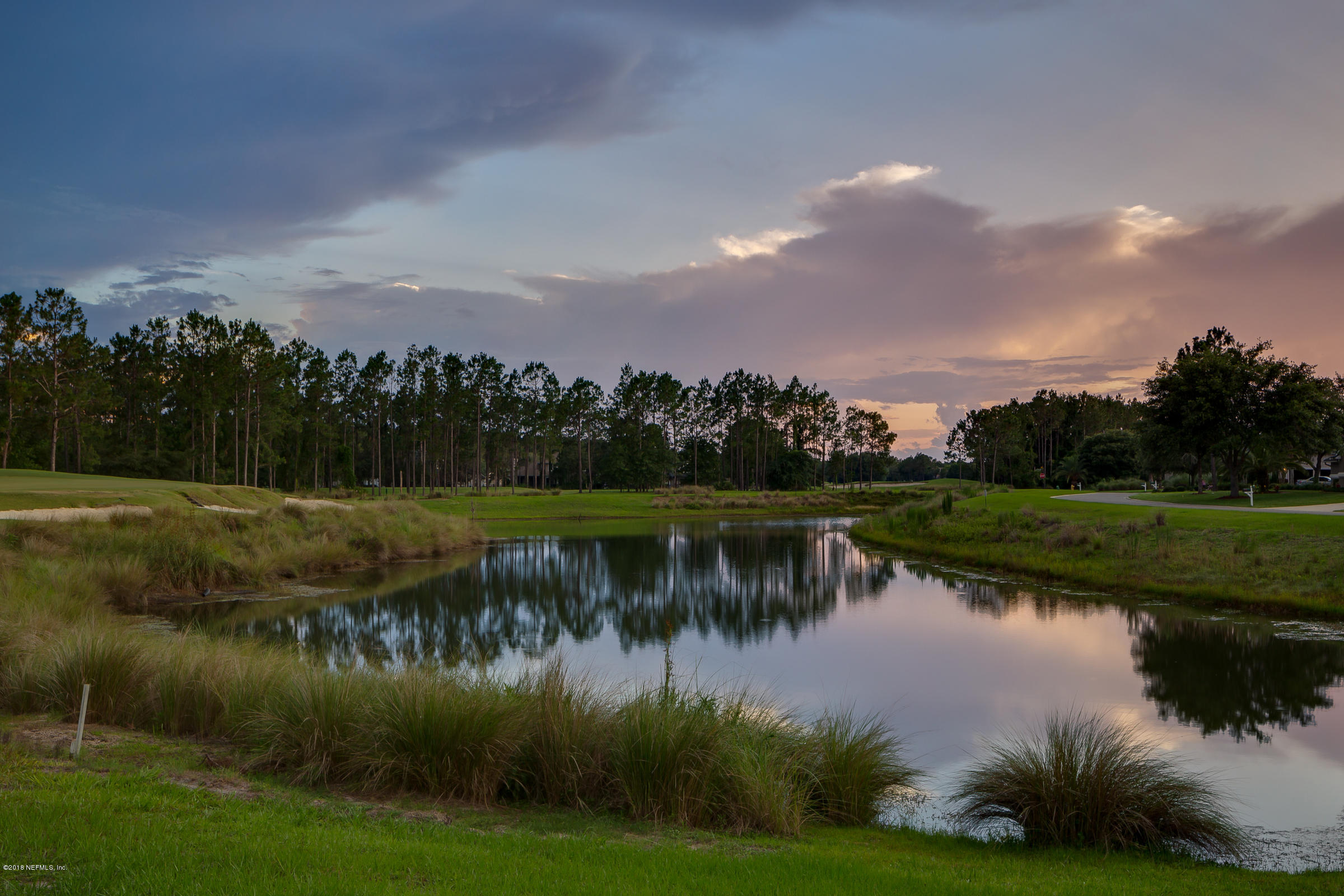 1925 Lyndhurst Drive St. Augustine, FL 32092 - Photo 46 of 52 a view of a lake with houses in the back