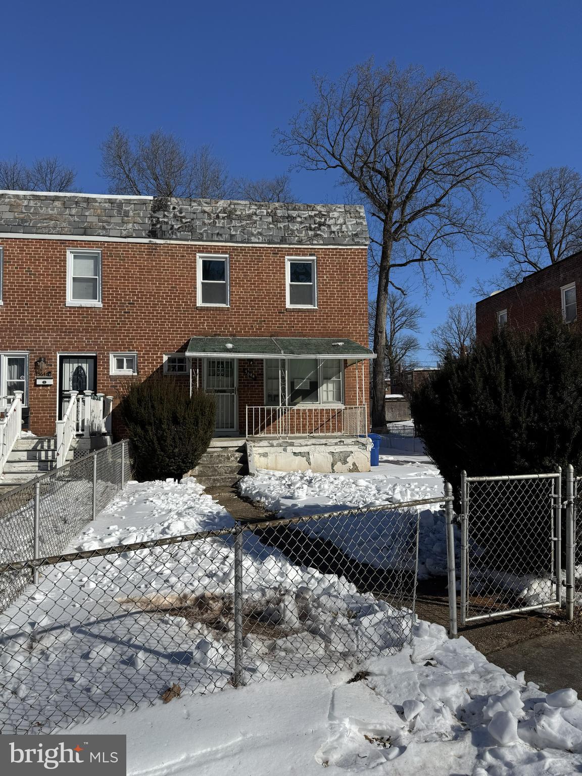 5644 Belle Avenue Baltimore, MD 21207 - Photo 1 of 14 a front view of a house with garden