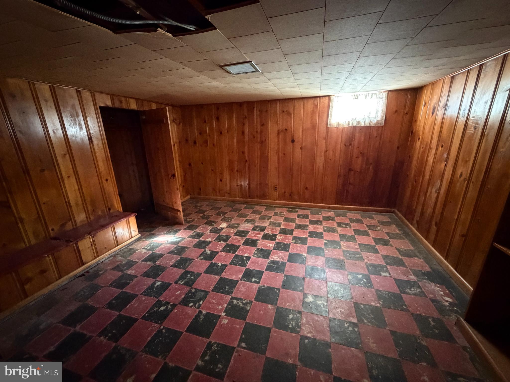 5644 Belle Avenue Baltimore, MD 21207 - Photo 10 of 14 a bathroom with a black and white checkered floor