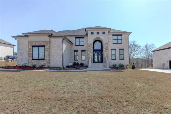 a front view of a house with yard