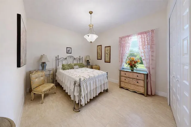 a spacious bathroom with a granite countertop sink a toilet and a mirror