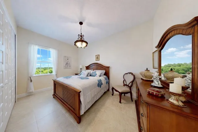 a living room with furniture a flat screen tv and a window