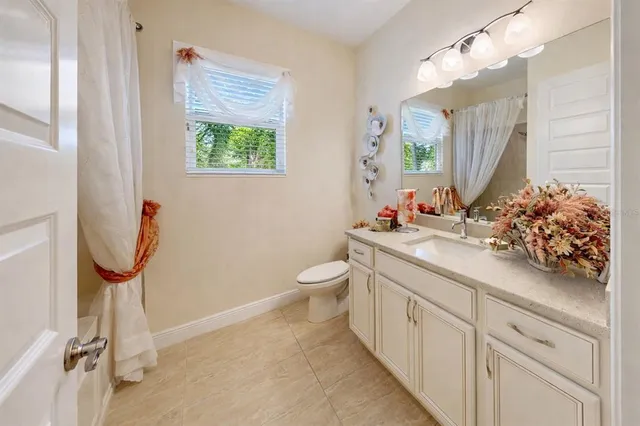 a bathroom with a double vanity sink and mirror