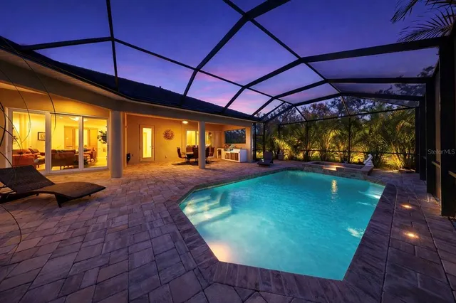 a view of a backyard with plants and patio