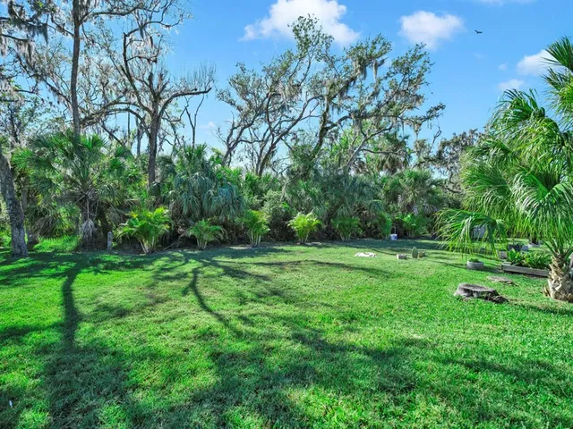a view of a backyard of the house
