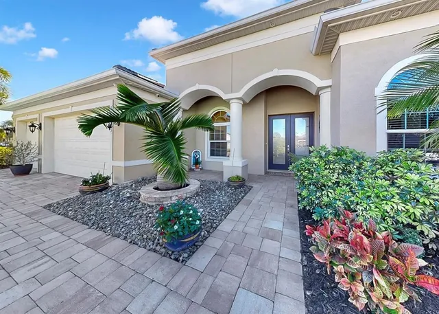 an aerial view of multiple houses with yard