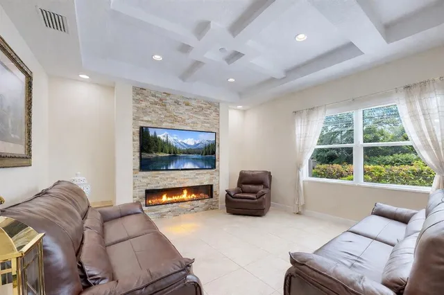 a living room with furniture and a window