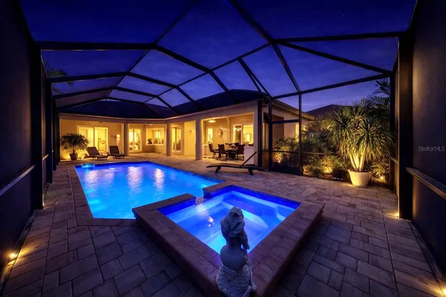 a view of a swimming pool with a chair